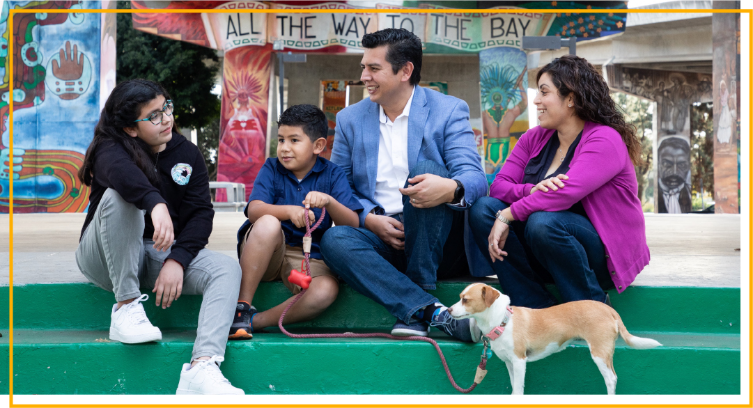 David Alvarez and his family in Chicano park with their dog